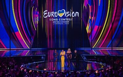 Hosts Alesha Dixon, Graham Norton, Hannah Waddingham and Julia Sanina appear on stage during the final of the Eurovision Song contest 2023 on May 13, 2023 at the M&S Bank Arena in Liverpool, northern England. (Paul Ellis/AFP)