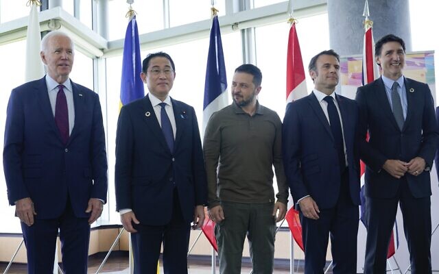 US President Joe Biden, Japan's Prime Minister Fumio Kishida, Ukraine's President Volodymyr Zelensky, France's President Emmanuel Macron, Canada's Prime Minister Justin Trudeau pose for a family photo ahead of a working session on Ukraine during the G7 Leaders' Summit in Hiroshima on May 21, 2023. (Susan Walsh / POOL / AFP) US President Joe Biden, Japan's Prime Minister Fumio Kishida, Ukraine's President Volodymyr Zelensky, France's President Emmanuel Macron, Canada's Prime Minister Justin Trudeau pose for a family photo ahead of a working session on Ukraine during the G7 Leaders' Summit in Hiroshima on May 21, 2023. (Susan Walsh / POOL / AFP)