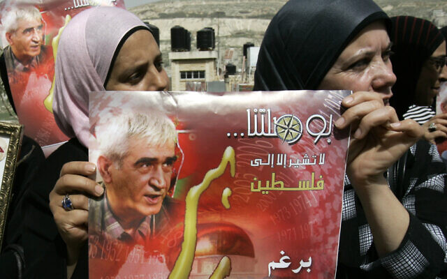 Palestinian supporters of the Popular Front for the Liberation of Palestine (PFLP) hold posters of the party's leader Ahmad Saadat, who is currently jailed in Israel, as they call for his release of during a protest in the West Bank city of Nablus, March 15, 2010. The Arabic text on the poster reads "Our compass doesn't point anywhere except to Palestine." (AP Photo/Nasser Ishtayeh) Palestinian supporters of the Popular Front for the Liberation of Palestine (PFLP) hold posters of the party's leader Ahmad Saadat, who is currently jailed in Israel, as they call for his release of during a protest in the West Bank city of Nablus, March 15, 2010. The Arabic text on the poster reads "Our compass doesn't point anywhere except to Palestine." (AP Photo/Nasser Ishtayeh)
