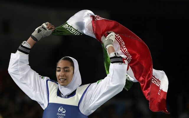 Illustrative: Kimia Alizadeh Zenoorin of Iran celebrates after winning the bronze medal in Taekwondo at the 2016 Summer Olympics in Rio de Janeiro, Brazil, August 18, 2016. (AP Photo/Andrew Medichini, File) Illustrative: Kimia Alizadeh Zenoorin of Iran celebrates after winning the bronze medal in Taekwondo at the 2016 Summer Olympics in Rio de Janeiro, Brazil, August 18, 2016. (AP Photo/Andrew Medichini, File)