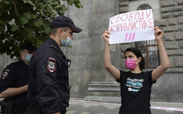 Police detain journalist Farida Rustamova holding a poster which reads 'Journalism Freedom,' during a protest outside the main headquarters of the country's top domestic security agency, the FSB, on Lubyanka Square in Moscow, Russia, Aug. 21, 2021 (AP Photo/Denis Kaminev, File) Police detain journalist Farida Rustamova holding a poster which reads 'Journalism Freedom,' during a protest outside the main headquarters of the country's top domestic security agency, the FSB, on Lubyanka Square in Moscow, Russia, Aug. 21, 2021 (AP Photo/Denis Kaminev, File)
