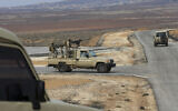 Illustrative - Jordanian soldiers patrol along the eastern Jordan-Syria border, in al-Washash, Mafraq governorate, Jordan, February 17, 2022. (Raad Adayleh/AP)