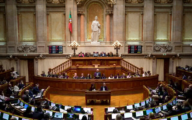 Illustrative: Portuguese Prime Minister Antonio Costa, standing in the center, answers a member of parliament during debate at the parliament in Lisbon, January 11, 2023. (AP Photo/Armando Franca) Illustrative: Portuguese Prime Minister Antonio Costa, standing in the center, answers a member of parliament during debate at the parliament in Lisbon, January 11, 2023. (AP Photo/Armando Franca)