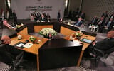 Jordan's Foreign Minister Ayman Safadi, center background, Saudi Arabia's Foreign Minister Prince Faisal bin Farhan Al Saud, second left, Iraqi Foreign Minister Fouad Hussein, left, Egyptian Foreign Minister Sameh Shoukry, right, and Syrian Foreign Minister Faisal Mekdad, second right, attend a regional consultative meeting in Amman, Jordan, May 1, 2023. (AP Photo/Raad Adayleh)