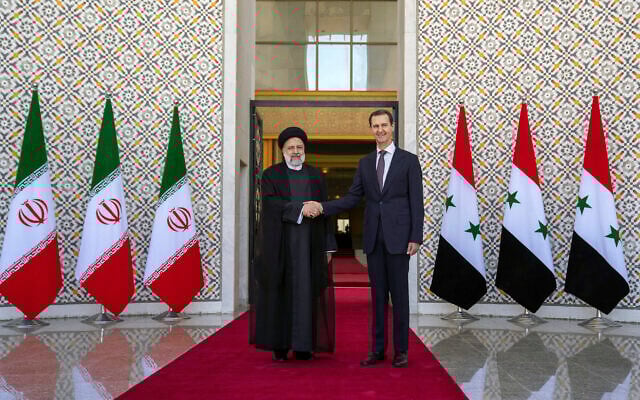In this photo released by the official Facebook page of the Syrian Presidency, Syrian President Bashar Assad, right, shakes hands with Iranian President Ebrahim Raisi in Damascus, Syria, May 3, 2023. (Syrian Presidency via Facebook via AP) In this photo released by the official Facebook page of the Syrian Presidency, Syrian President Bashar Assad, right, shakes hands with Iranian President Ebrahim Raisi in Damascus, Syria, May 3, 2023. (Syrian Presidency via Facebook via AP)