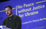 Ukraine's President Volodymyr Zelensky delivers a speech titled 'No Peace Without Justice for Ukraine,' in the Hague, Netherlands, May 4, 2023. (Yves Herman/Pool via AP)