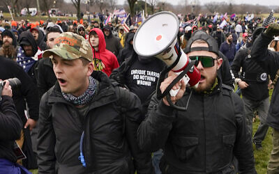 File: Proud Boys members Zachary Rehl, left, and Ethan Nordean, right, walk toward the US Capitol in Washington, in support of President Donald Trump on Jan. 6, 2021. Former Proud Boys leader Enrique Tarrio and three other members of the far-right extremist group were convicted Thursday, May 4, 2023, of a plot to attack the US Capitol in a desperate bid to keep Donald Trump in power after the Republican lost the 2020 presidential election. (AP/Carolyn Kaster)