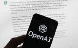 The OpenAI logo is seen on a mobile phone in front of a computer screen displaying output from ChatGPT, on March 21, 2023, in Boston. (AP Photo/Michael Dwyer, File)