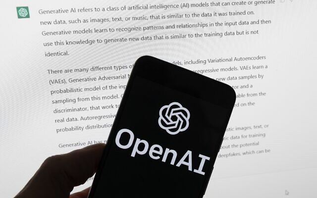 The OpenAI logo is seen on a mobile phone in front of a computer screen displaying output from ChatGPT, on March 21, 2023, in Boston. (AP Photo/Michael Dwyer, File) The OpenAI logo is seen on a mobile phone in front of a computer screen displaying output from ChatGPT, on March 21, 2023, in Boston. (AP Photo/Michael Dwyer, File)