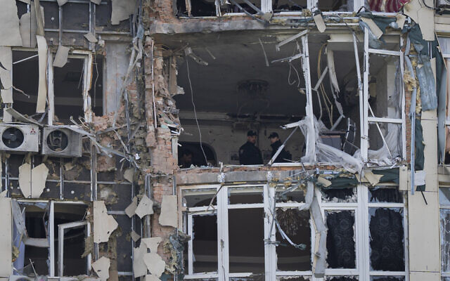 Police inspect an apartment building damaged by a drone, that was shot down during a Russian overnight strike, in Kyiv, Ukraine, Monday, May 8, 2023. (AP Photo/Andrew Kravchenko) Police inspect an apartment building damaged by a drone, that was shot down during a Russian overnight strike, in Kyiv, Ukraine, Monday, May 8, 2023. (AP Photo/Andrew Kravchenko)