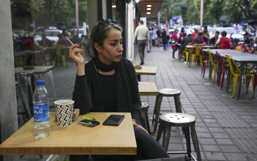 A woman sits in the alfresco dining area of a cafe at the Tajrish commercial district without wearing her mandatory Islamic headscarf in northern Tehran, Iran, April 29, 2023. (AP Photo/Vahid Salemi) A woman sits in the alfresco dining area of a cafe at the Tajrish commercial district without wearing her mandatory Islamic headscarf in northern Tehran, Iran, April 29, 2023. (AP Photo/Vahid Salemi)