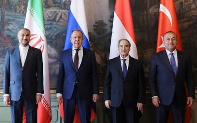Iran's Foreign Minister Hossein Amirabollahian, left, Russia's Foreign Minister Sergey Lavrov, second left, Syria's Foreign Minister Faisal Mekdad, second right, and Turkey's Foreign Minister Mevlut Cavusoglu pose for a photo prior to their talks in Moscow, May 10, 2023. (Russian Foreign Ministry Press Service via AP)