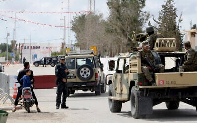 Police officers and soldiers stand near Ghriba synagogue in Djerba, Tunisia, May 10, 2023. (Moncef Abidi/AP)