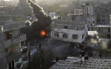 Smoke and fire rise from an explosion caused by an Israeli airstrike targeting a building in Gaza, May 13, 2023. The building was owned by an Islamic Jihad official. (AP Photo/Ashraf Amra)