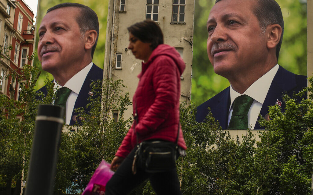 A person walks past billboards of Turkish President and People's Alliance's presidential candidate Recep Tayyip Erdogan a day after the presidential election day, in Istanbul, Turkey, May 15, 2023. (Emrah Gurel/AP) A person walks past billboards of Turkish President and People's Alliance's presidential candidate Recep Tayyip Erdogan a day after the presidential election day, in Istanbul, Turkey, May 15, 2023. (Emrah Gurel/AP)