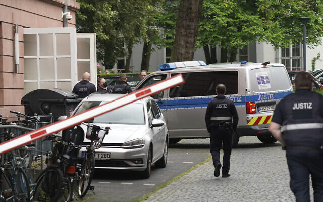 Judiciary vans, each carrying defendants, drive in a courtyard before the start of the trial against members of the 'United Patriots' group at the Higher Regional Court in Koblenz, Germany, May 17, 2023. (Sebastian Gollnow/dpa via AP) Judiciary vans, each carrying defendants, drive in a courtyard before the start of the trial against members of the 'United Patriots' group at the Higher Regional Court in Koblenz, Germany, May 17, 2023. (Sebastian Gollnow/dpa via AP)