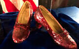File: A pair of ruby slippers once worn by actress Judy Garland in the "The Wizard of Oz" sit on display at a news conference at the FBI office in Brooklyn Center, Minnesota, September 4, 2018. (AP Photo/Jeff Baenen)