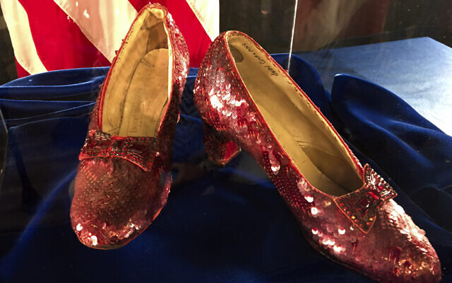 File: A pair of ruby slippers once worn by actress Judy Garland in the "The Wizard of Oz" sit on display at a news conference at the FBI office in Brooklyn Center, Minnesota, September 4, 2018. (AP Photo/Jeff Baenen) File: A pair of ruby slippers once worn by actress Judy Garland in the "The Wizard of Oz" sit on display at a news conference at the FBI office in Brooklyn Center, Minnesota, September 4, 2018. (AP Photo/Jeff Baenen)