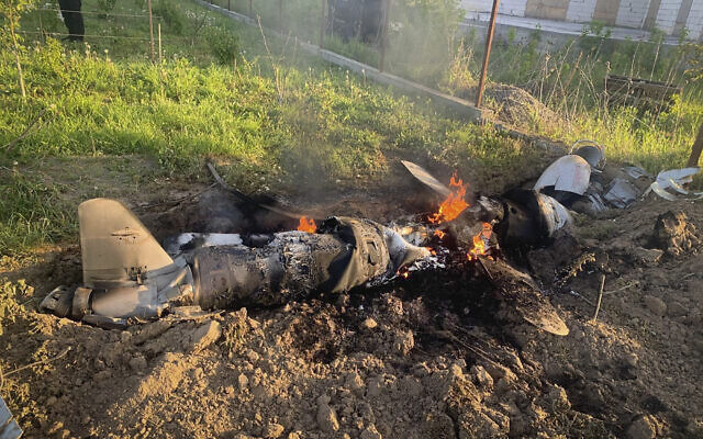 In this photo provided by the Ukrainian Police Press Office, fragments of a Russian rocket which was shot down by Ukraine's air defence system are seen after the night rocket attack in the Kyiv region, Ukraine, May 18, 2023. (Ukrainian Police Press Office via AP) In this photo provided by the Ukrainian Police Press Office, fragments of a Russian rocket which was shot down by Ukraine's air defence system are seen after the night rocket attack in the Kyiv region, Ukraine, May 18, 2023. (Ukrainian Police Press Office via AP)