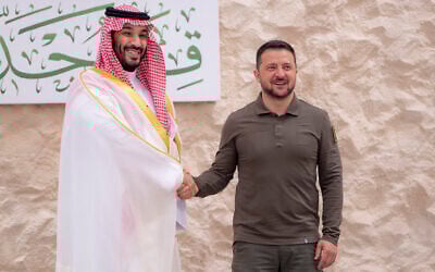 Saudi Crown Prince Mohammed bin Salman greets Ukraine's President Volodymyr Zelensky, right, during the Arab summit in Jeddah, Saudi Arabia, May 19, 2023. (Saudi Press Agency via AP)