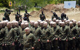Fighters from the Lebanese terror group Hezbollah carry out a training exercise in Aaramta village in the Jezzine District, southern Lebanon, May 21, 2023. (AP Photo/Hassan Ammar)