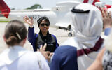 Saudi Arabian astronaut Rayyanah Barnawi waves to family and friends as she arrives at the Kennedy Space Center in Cape Canaveral, Fla., for a scheduled launch Sunday, May 21, 2023. (AP/John Raoux)