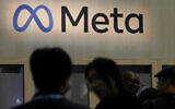 Attendees visit the Meta booth at the Game Developers Conference 2023 in San Francisco, March 22, 2023. (AP Photo/Jeff Chiu, File)