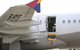 An Asiana Airlines plane is parked as one of the plane's doors suddenly opened at Daegu International Airport in Daegu, South Korea, Friday, May 26, 2023. (Yun Kwan-shick/Yonhap via AP)