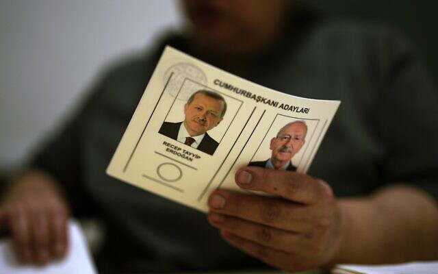 An election representative holds a ballot with presidential candidates at a polling station in Istanbul, Turkey, May 28, 2023 (AP Photo/Francisco Seco) An election representative holds a ballot with presidential candidates at a polling station in Istanbul, Turkey, May 28, 2023 (AP Photo/Francisco Seco)