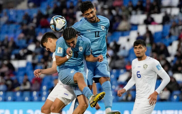 Uzbekistan's Shakhzodjon Nematjonov, left, goes for a header with Israel's Tay Abed, (15) and Roy Revivo (12) during a FIFA U-20 World Cup round of 16 soccer match at the Malvinas Argentinas stadium in Mendoza, Argentina, May 30, 2023. (AP Photo/Ricardo Mazalan) Uzbekistan's Shakhzodjon Nematjonov, left, goes for a header with Israel's Tay Abed, (15) and Roy Revivo (12) during a FIFA U-20 World Cup round of 16 soccer match at the Malvinas Argentinas stadium in Mendoza, Argentina, May 30, 2023. (AP Photo/Ricardo Mazalan)