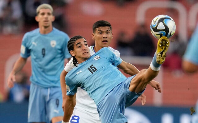 Israel's Tay Abed (15) fights for the ball with Uzbekistan's Bekhruzbek Askarov during a FIFA U-20 World Cup round of 16 soccer match at the Malvinas Argentinas stadium in Mendoza, Argentina, May 30, 2023. (AP Photo/Ricardo Mazalan) Israel's Tay Abed (15) fights for the ball with Uzbekistan's Bekhruzbek Askarov during a FIFA U-20 World Cup round of 16 soccer match at the Malvinas Argentinas stadium in Mendoza, Argentina, May 30, 2023. (AP Photo/Ricardo Mazalan)