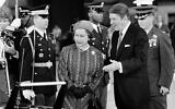 President Ronald Reagan escorts Queen Elizabeth II to a waiting limousine, March 1, 1983, following their meeting in Santa Barbara, Calif.  (AP Photo)