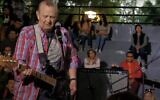 Screen capture from undated video of Chas Newby performing at a concert. (YouTube. Used in accordance with Clause 27a of the Copyright Law)