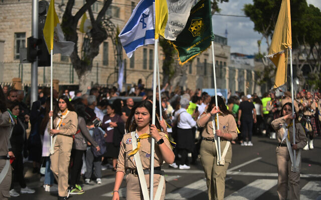 Arab-Christian Scouts march at the Virgin Mary Procession in Haifa, Israel on April 30, 2023. (Canaan Lidor/Times of Israel)