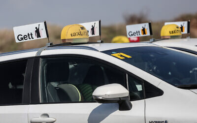 Taxis park during a protest against a change in meter prices in Tel Aviv, March 2, 2021. (Miriam Alster/Flash90)