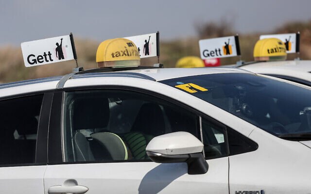 Taxis park during a protest against a change in meter prices in Tel Aviv, March 2, 2021. (Miriam Alster/Flash90) Taxis park during a protest against a change in meter prices in Tel Aviv, March 2, 2021. (Miriam Alster/Flash90)
