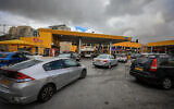 A traffic jam at the entrance to a gas station in Jerusalem, on March 11, 2022. (Jamal Awad/Flash90)