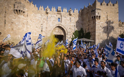 Thousands of Jews wave Israeli flags as they celebrate Jerusalem Day by dancing at Damascus Gate in Jerusalem's Old City, during Jerusalem Day, May 29, 2022. (Nati Shohat/Flash90) Thousands of Jews wave Israeli flags as they celebrate Jerusalem Day by dancing at Damascus Gate in Jerusalem's Old City, during Jerusalem Day, May 29, 2022. (Nati Shohat/Flash90)