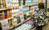 File: People shop for dairy products at the Shufersal Deal supermarket in Katzrin, on November 28, 2022. (Michael Giladi/Flash90)