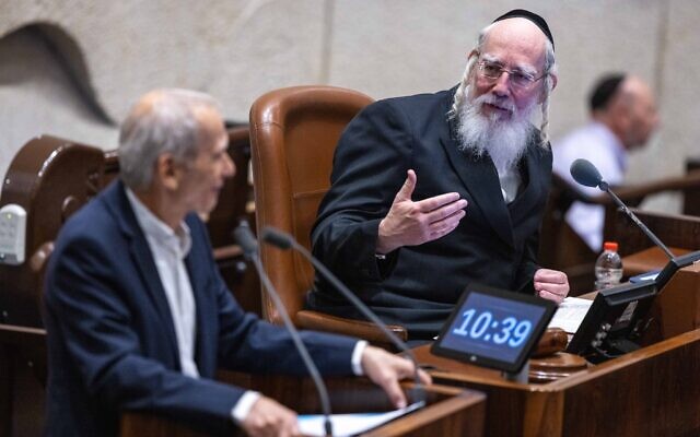 UTJ MK and Deputy Knesset Speaker Yisrael Eichler (right) during a vote in the Knesset, in Jerusalem, on December 28, 2022. (Olivier Fitoussi/Flash90) UTJ MK and Deputy Knesset Speaker Yisrael Eichler (right) during a vote in the Knesset, in Jerusalem, on December 28, 2022. (Olivier Fitoussi/Flash90)