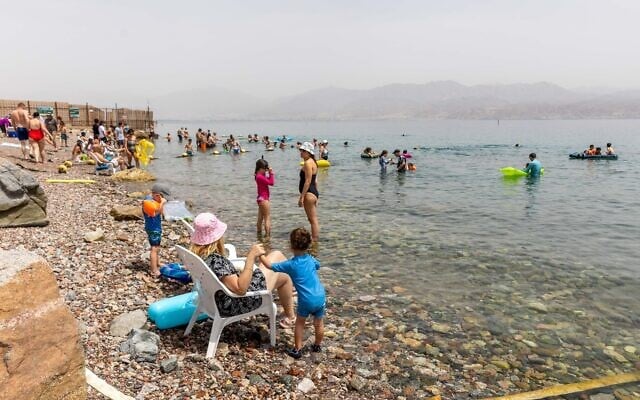 Illustrative: Israelis crowd a beach near Eilat, southern Israel, on April 7, 2023. (Yossi Aloni/Flash90