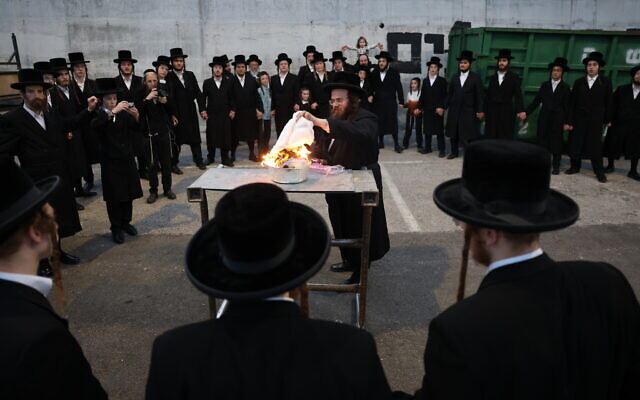 Worshipers light a bonfire a day before the Lag b'Omer celebrations, in Meron, on May 7, 2023. (David Cohen/Flash90) Worshipers light a bonfire a day before the Lag b'Omer celebrations, in Meron, on May 7, 2023. (David Cohen/Flash90)