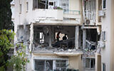 Police and rescue forces at the scene where a rocket fired from Gaza hit and damaged a house in Rehovot on May 11, 2023, killing resident Inga Avramyan. (Flash90)