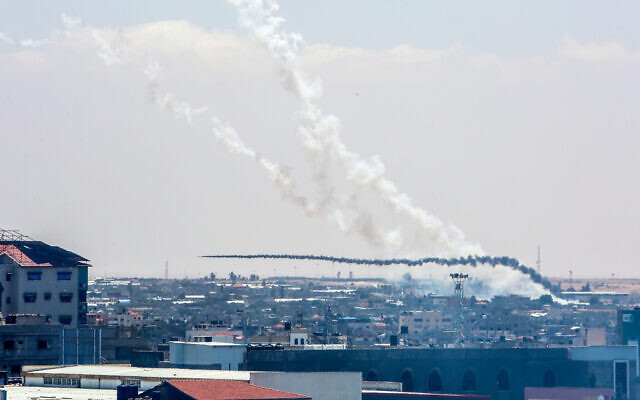 Trails of smoke are seen as rockets are fired from Gaza toward Israel, with one apparent misfire, in Khan Younis, southern Gaza Strip, on May 13, 2023. (Abed Rahim Khatib/Flash90) Trails of smoke are seen as rockets are fired from Gaza toward Israel, with one apparent misfire, in Khan Younis, southern Gaza Strip, on May 13, 2023. (Abed Rahim Khatib/Flash90)