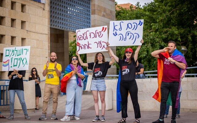 Members of the LGBQT community and supporters protest against Jerusalem city council member Yonatan Yosef, outside the Jerusalem Municipality town hall on May 22, 2023. (Yonatan Sindel/Flash90) Members of the LGBQT community and supporters protest against Jerusalem city council member Yonatan Yosef, outside the Jerusalem Municipality town hall on May 22, 2023. (Yonatan Sindel/Flash90)