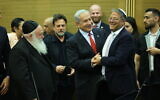 Prime Minister Benjamin Netanyahu (C) shakes hands with National Security Minister Itamar Ben Gvir (R) at the Knesset, alongside other coalition party heads ahead of passing the 2023-2024 state budget vote, May 23, 2023. (Yonatan Sindel/Flash90)