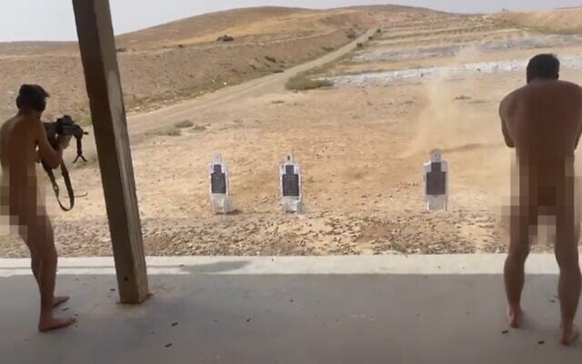 Two nude soldiers are seen at a firing range at the Nahal training base in southern Israel, May 18, 2023. (Video screenshot) Two nude soldiers are seen at a firing range at the Nahal training base in southern Israel, May 18, 2023. (Video screenshot)