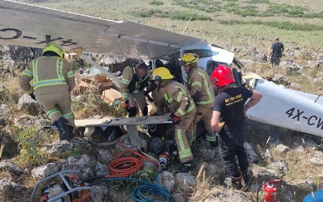 This handout photo shows rescue workers at the scene of a light plane crash in northern Israel on May 15, 2023. (Israel Fire and Rescue Services) This handout photo shows rescue workers at the scene of a light plane crash in northern Israel on May 15, 2023. (Israel Fire and Rescue Services)