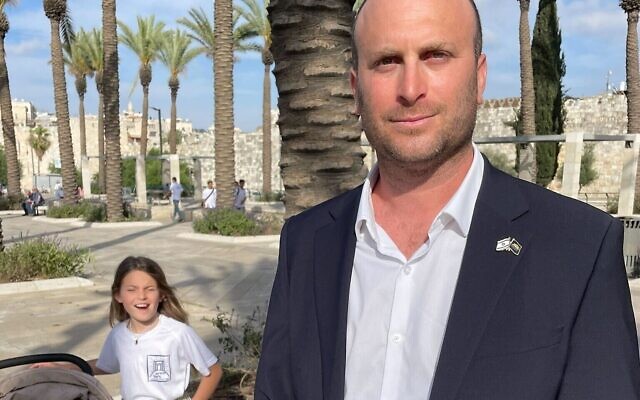 Otzma Yehudi MK Yitzhak Kroizer poses for a photo with his daughters at the Jerusalem Day Flag March just outside the Old City, May 18, 2023. (Jeremy Sharon/Times of Israel) Otzma Yehudi MK Yitzhak Kroizer poses for a photo with his daughters at the Jerusalem Day Flag March just outside the Old City, May 18, 2023. (Jeremy Sharon/Times of Israel)