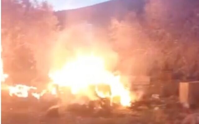 Palestinian vehicles allegedly set on fire by settlers near the West Bank village of Burqa on May 24, 2023. (Screen capture/Twitter: used in accordance with Clause 27a of the Copyright Law)